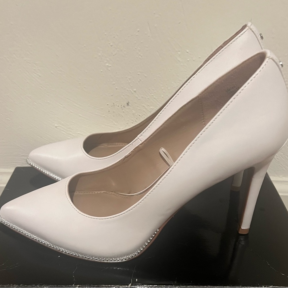 Woman’s size 9 BCBG white heels